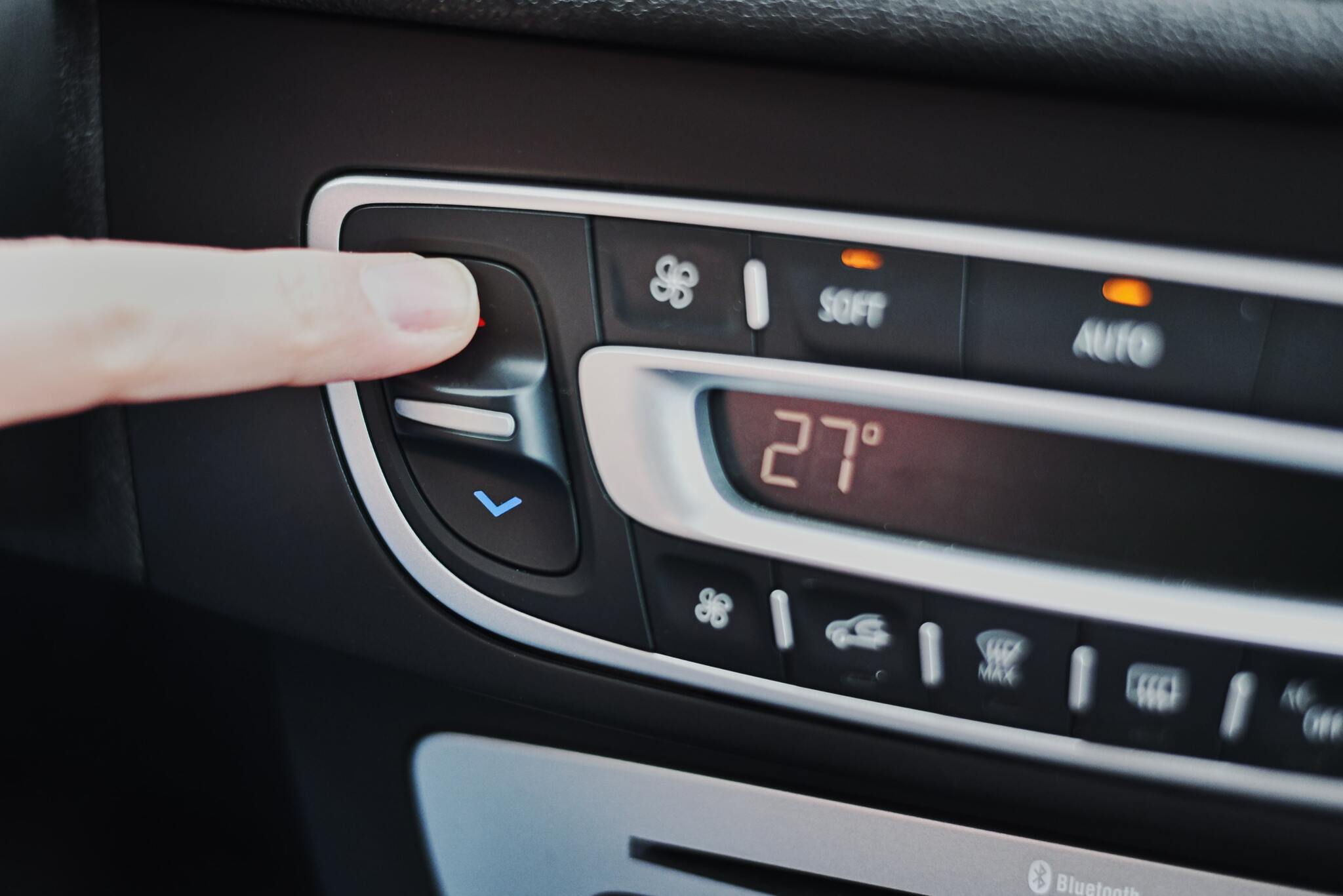 Woman hand set the temperature on air conditioner 2025 03 15 06 52 26 utc min