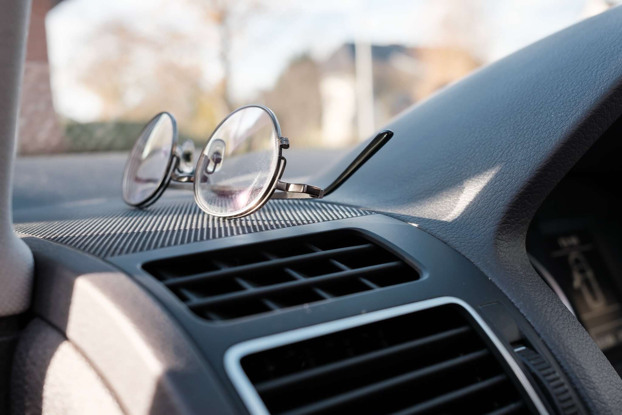 Glasses on the dashboard of a car accessory for d 2025 01 15 12 40 22 utc min